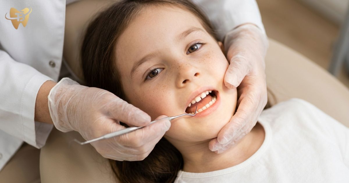 Pediatric dentist checking a child’s baby teeth before pulpotomy or pulpectomy baby root canal treatment